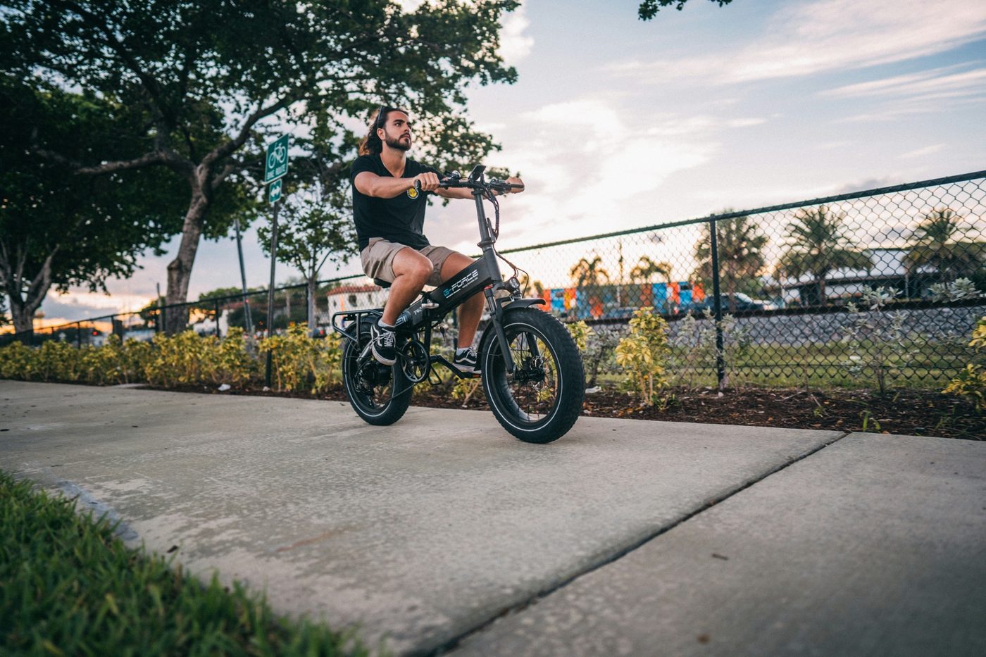 Rider on a compact folding-style fat-tire e-bike